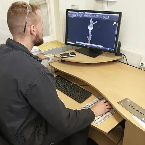 Jack working on a CAD drawing of a pendulum mill at Fernite Engineering Jack working on a CAD drawing of a pendulum mill at Fernite Engineering